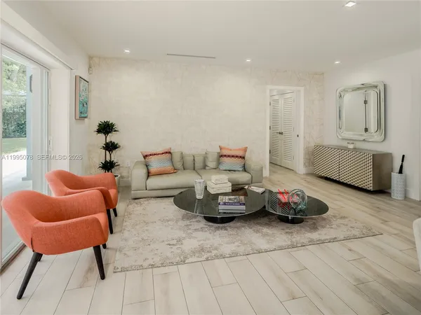 a living room with furniture and a window