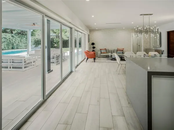 a view of a room with kitchen view and living room view