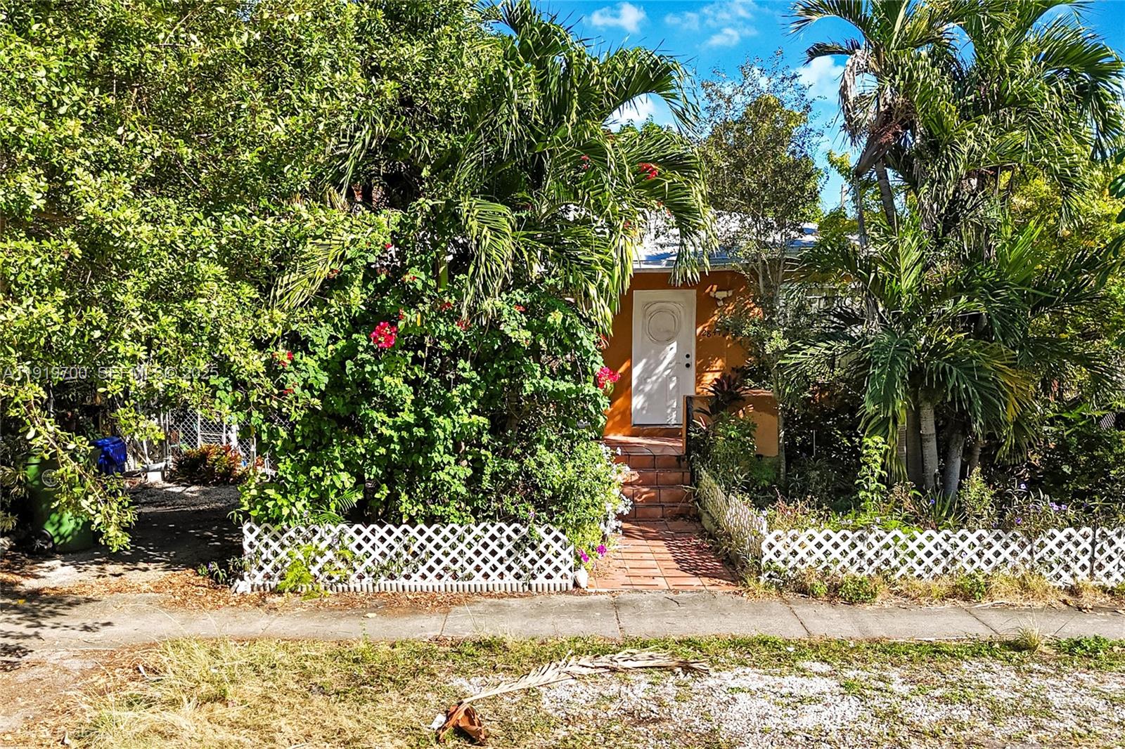 2845 Southwest 37th Court Miami, FL 33134 - Photo 2 of 9 a view of a yard with plants and tree