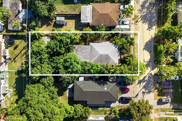 an aerial view of house with a garden