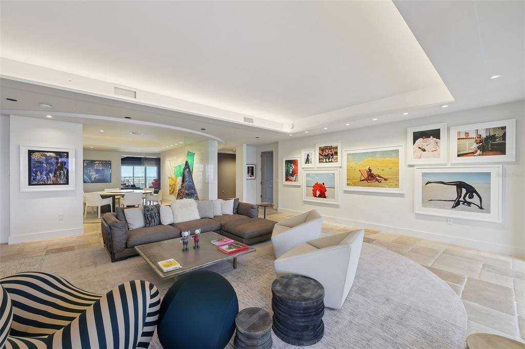 1111 Ritz Carlton Drive, Unit 1704 Sarasota, FL 34236 - Photo 16 of 53 a living room with furniture and wooden floor