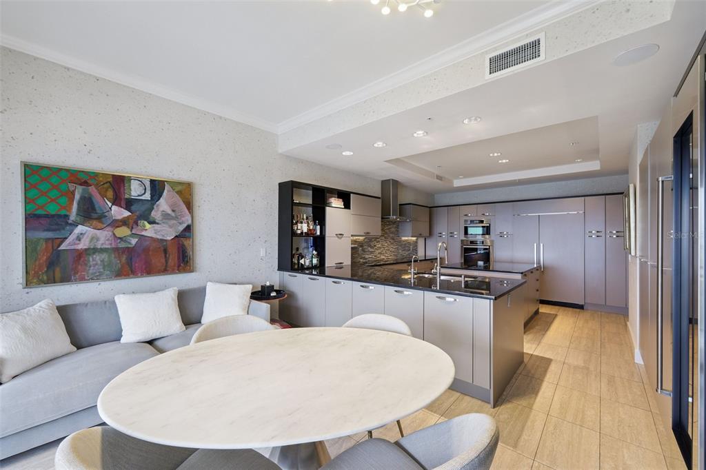 1111 Ritz Carlton Drive, Unit 1704 Sarasota, FL 34236 - Photo 25 of 53 a living room with stainless steel appliances furniture a dining table and kitchen view