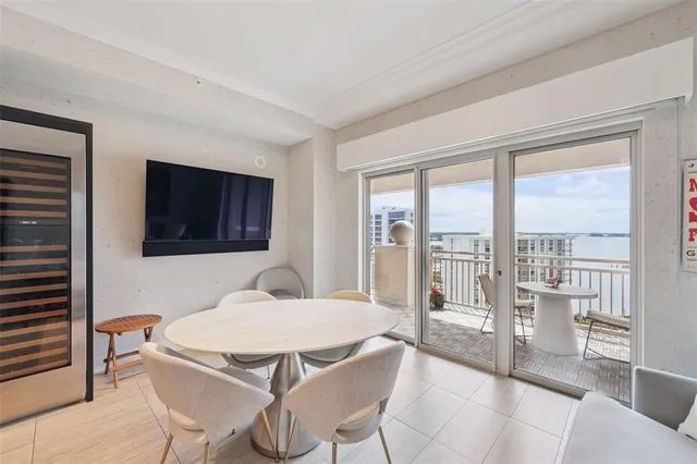 a kitchen with a table chairs sink and microwave