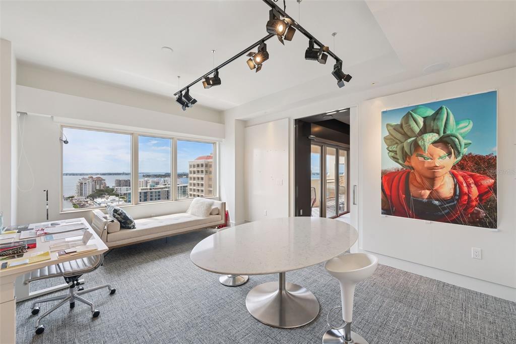1111 Ritz Carlton Drive, Unit 1704 Sarasota, FL 34236 - Photo 31 of 53 a living room with furniture and wooden floor