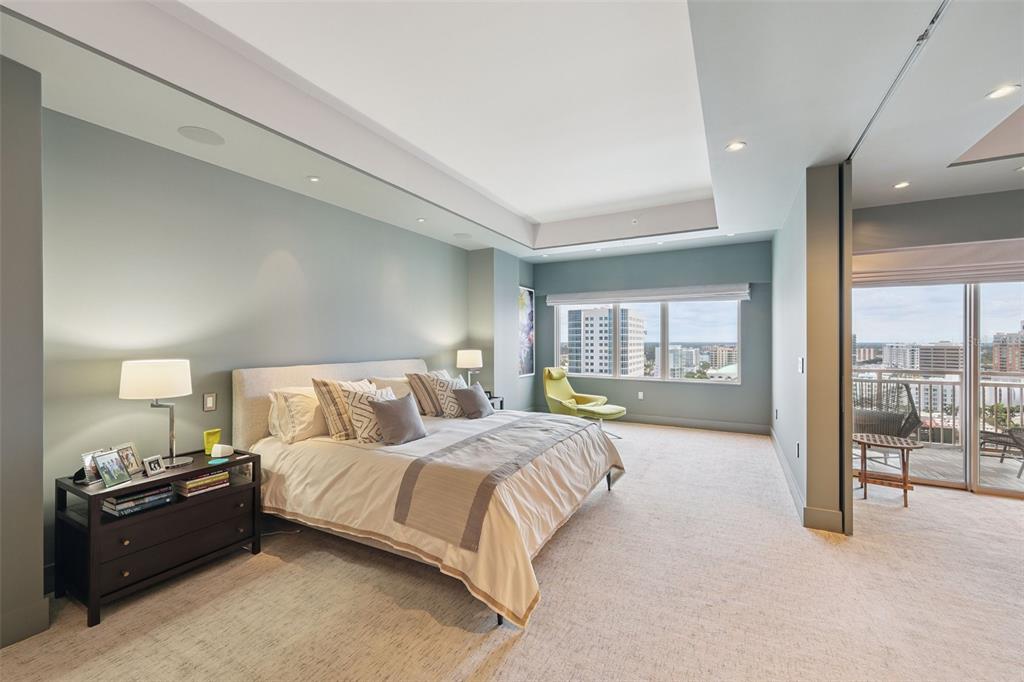 1111 Ritz Carlton Drive, Unit 1704 Sarasota, FL 34236 - Photo 36 of 53 a spacious bedroom with a large bed and a large window