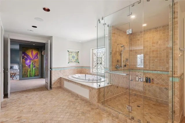 an aerial view of a house with outdoor seating