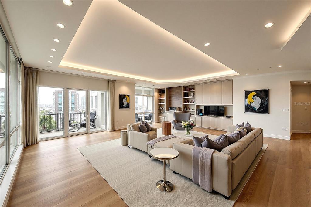 1111 Ritz Carlton Drive, Unit 1704 Sarasota, FL 34236 - Photo 6 of 53 a living room with furniture and a wooden floor