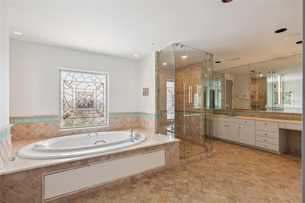 1111 Ritz Carlton Drive, Unit 1704 Sarasota, FL 34236 - Photo 10 of 53 a large spacious bathroom with a tub sink shower and mirror