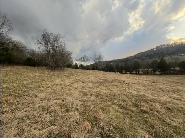 a view of swimming pool with an outdoor seating