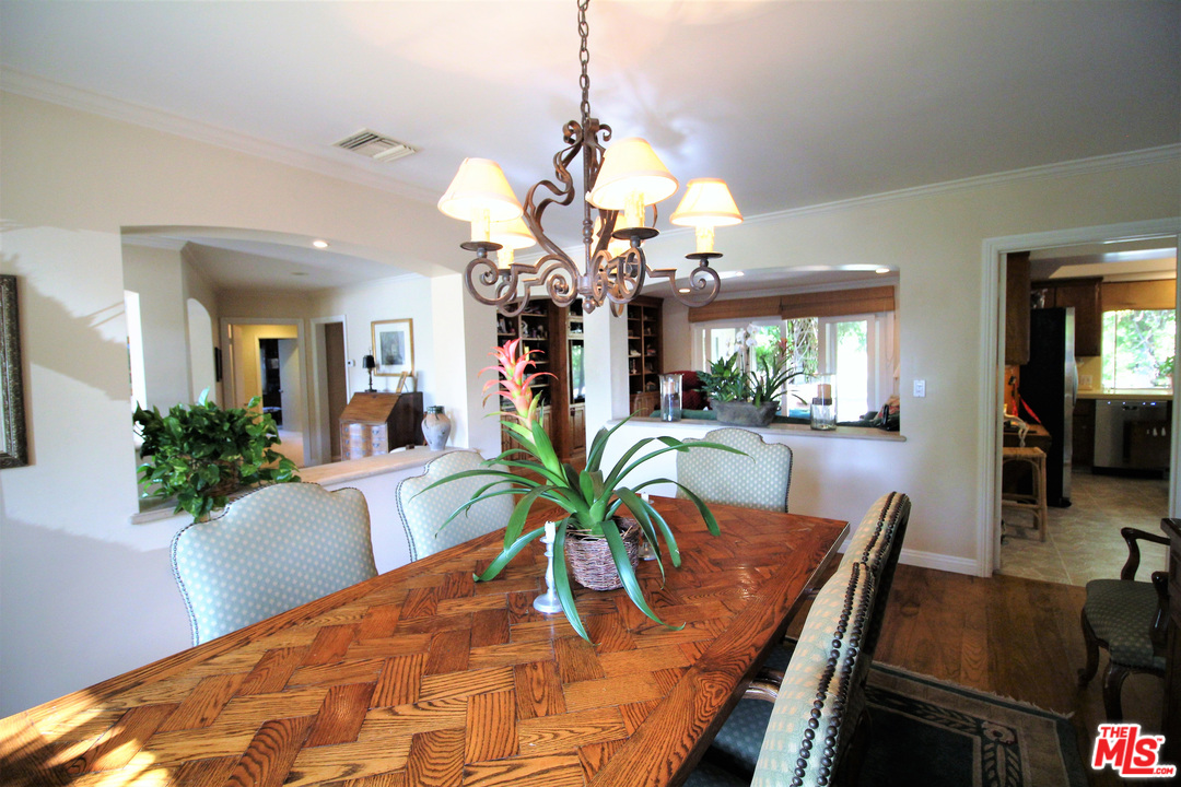 20219 Inland Lane Malibu, CA 90265 - Photo 15 of 28 a view of a dining room with furniture and wooden floor