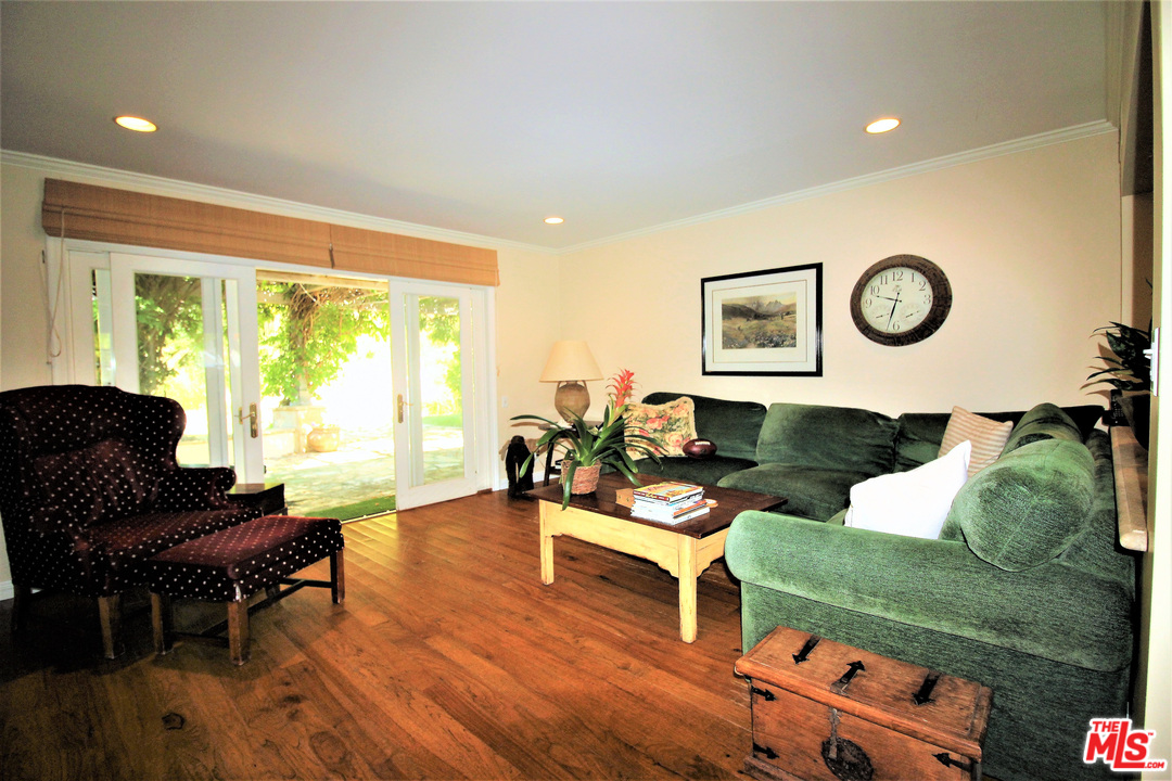 20219 Inland Lane Malibu, CA 90265 - Photo 16 of 28 a living room with furniture and a large window
