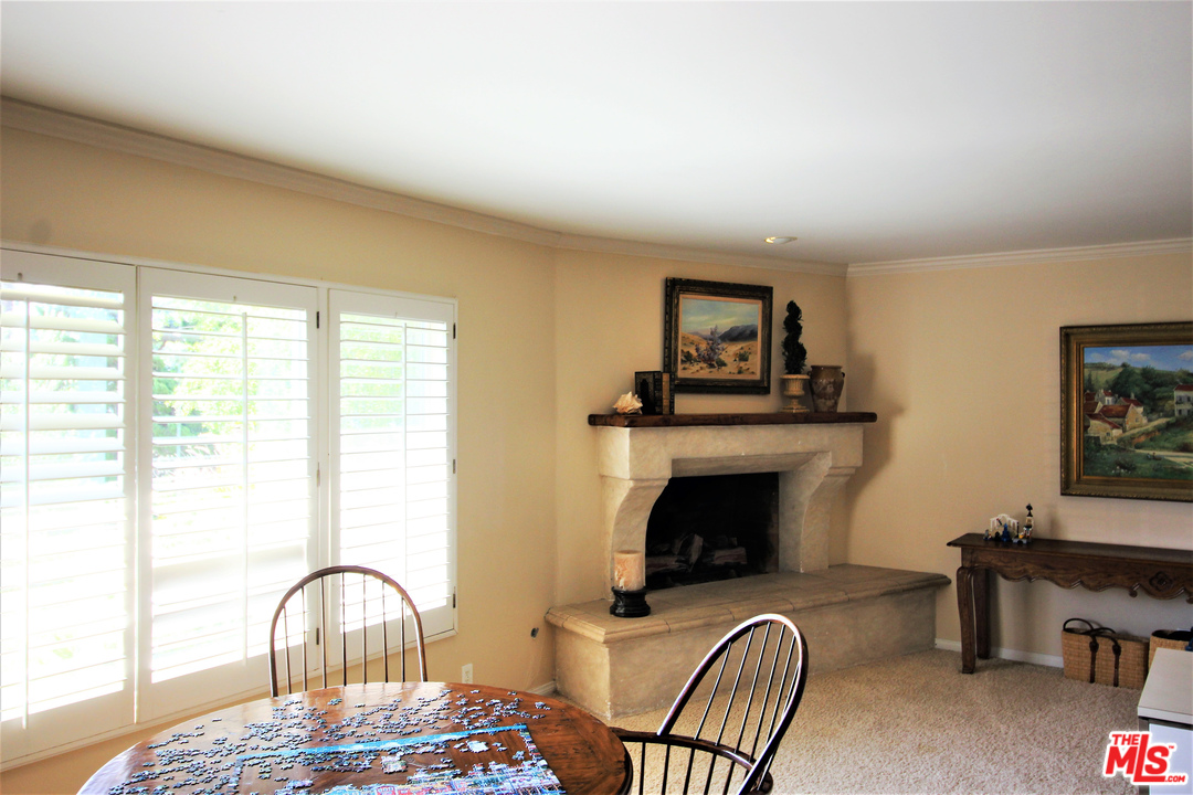 20219 Inland Lane Malibu, CA 90265 - Photo 18 of 28 a view of a livingroom with furniture and a fireplace