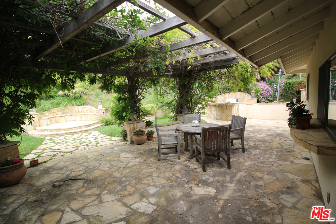 20219 Inland Lane Malibu, CA 90265 - Photo 20 of 28 a view of a tables and chairs in patio