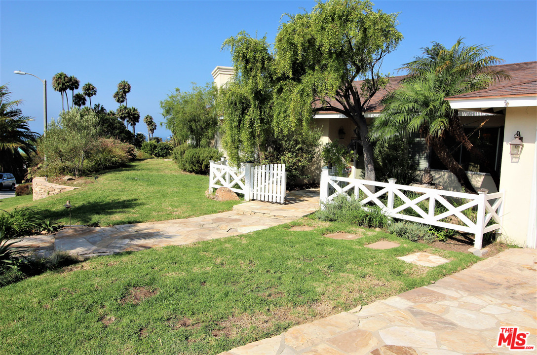 20219 Inland Lane Malibu, CA 90265 - Photo 3 of 28 a view of a backyard with a garden and plants