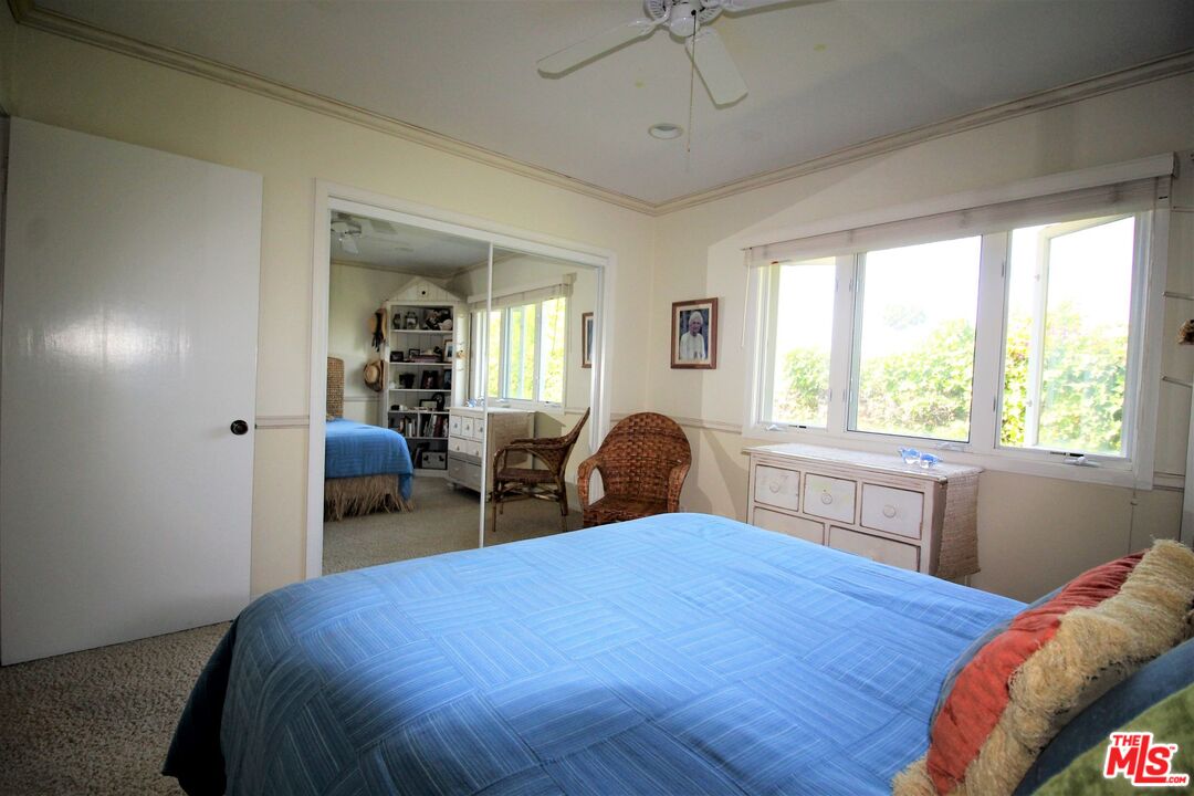 20219 Inland Lane Malibu, CA 90265 - Photo 21 of 28 a bed sitting in a bedroom next to a window