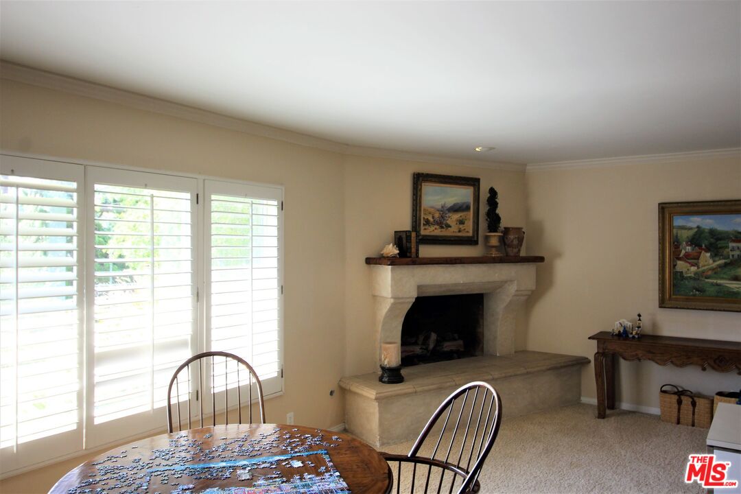 20219 Inland Lane Malibu, CA 90265 - Photo 8 of 28 a view of a livingroom with furniture and a fireplace