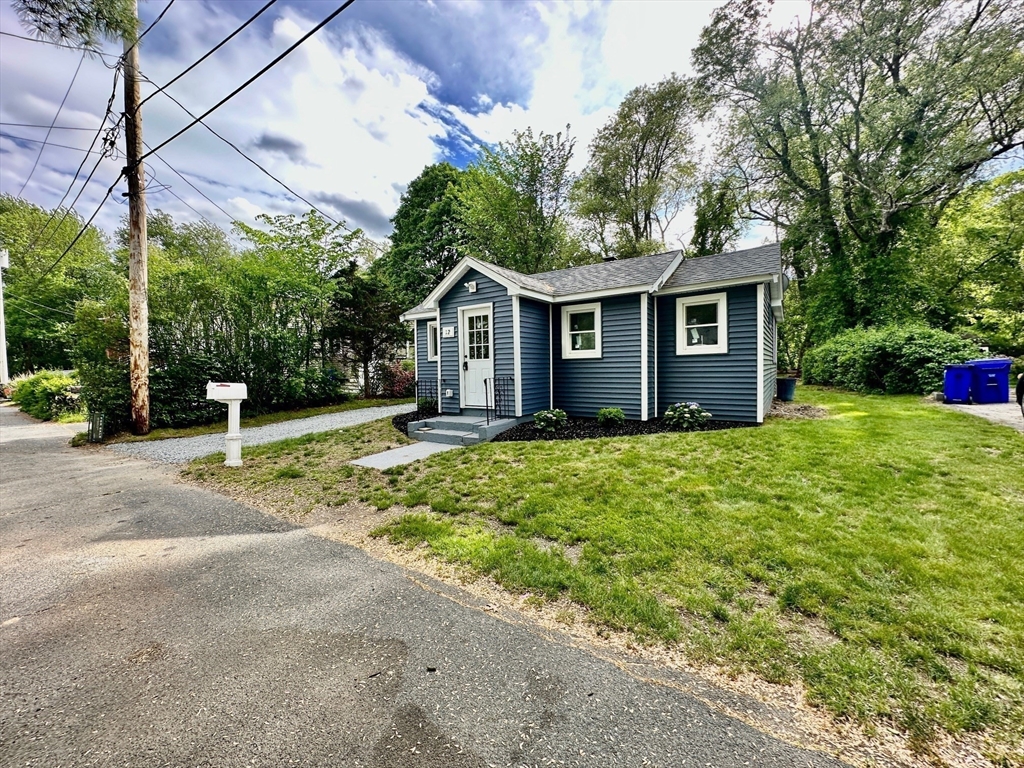 12 English Road Holbrook, MA 02343 - Photo 11 of 12 a view of a house with a yard and potted plants