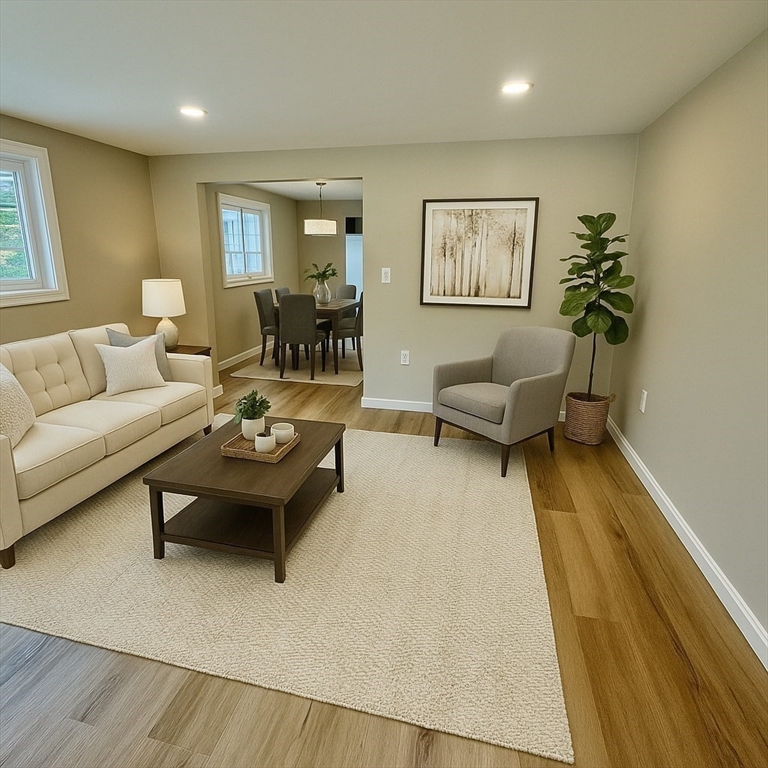 12 English Road Holbrook, MA 02343 - Photo 2 of 12 a living room with furniture and a couch