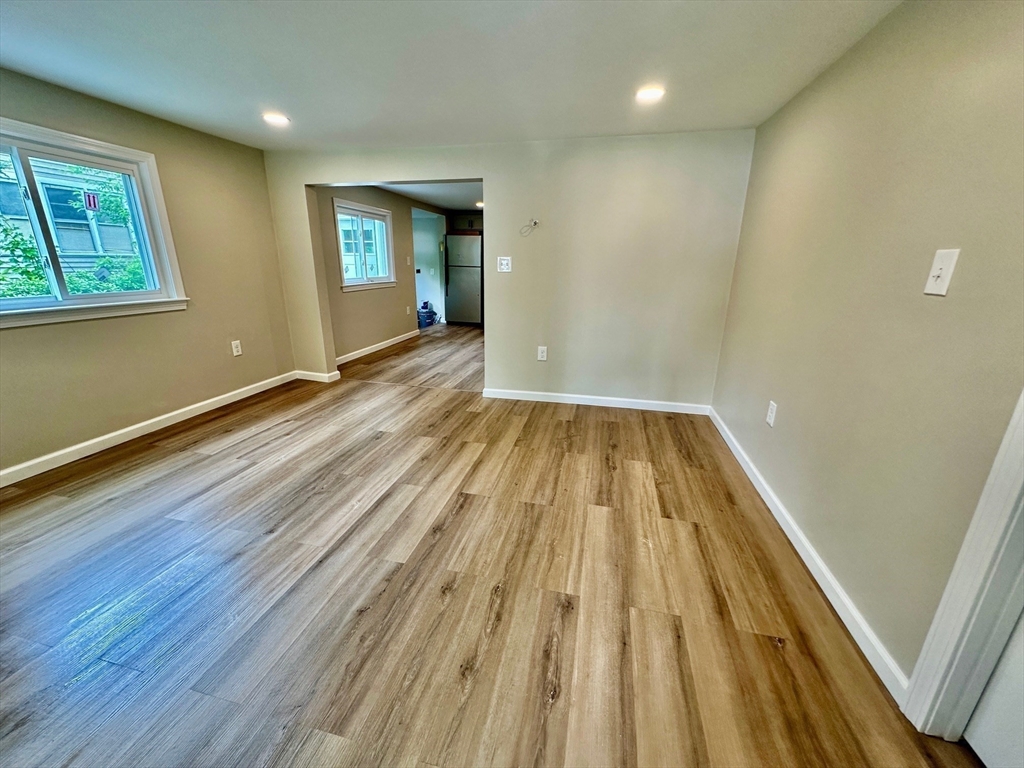 12 English Road Holbrook, MA 02343 - Photo 3 of 12 a view of wooden floor in an empty room with a window