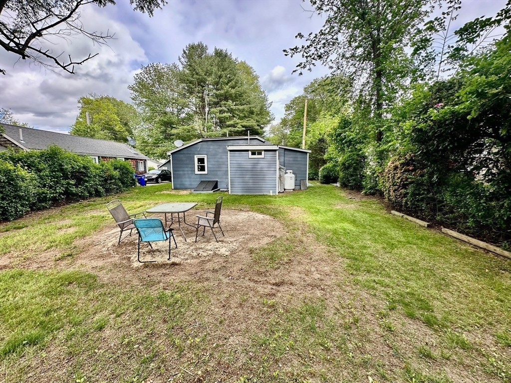 12 English Road Holbrook, MA 02343 - Photo 10 of 12 a view of a house with a yard and sitting area