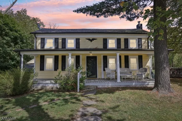 a front view of house with outdoor seating