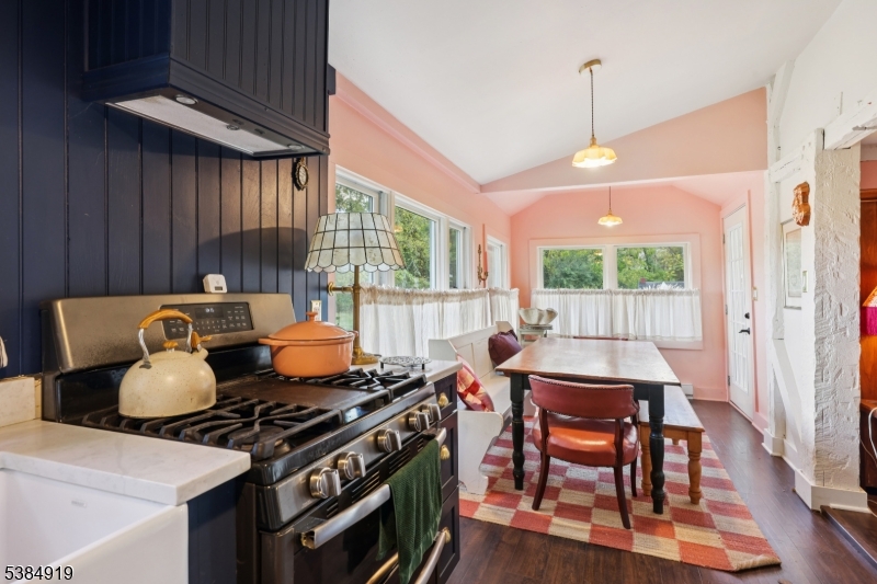 198 Libertyville Road Wantage, NJ 07461 - Photo 12 of 29 a table and chairs in a kitchen next to a window