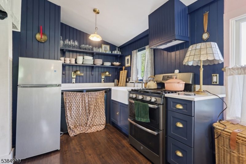 198 Libertyville Road Wantage, NJ 07461 - Photo 13 of 29 a kitchen with stainless steel appliances granite countertop a stove a refrigerator and a cabinets