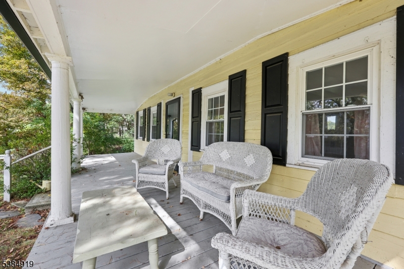 198 Libertyville Road Wantage, NJ 07461 - Photo 4 of 29 a balcony with furniture and a garden