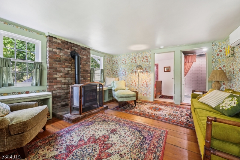 198 Libertyville Road Wantage, NJ 07461 - Photo 6 of 29 a living room with furniture and a fireplace