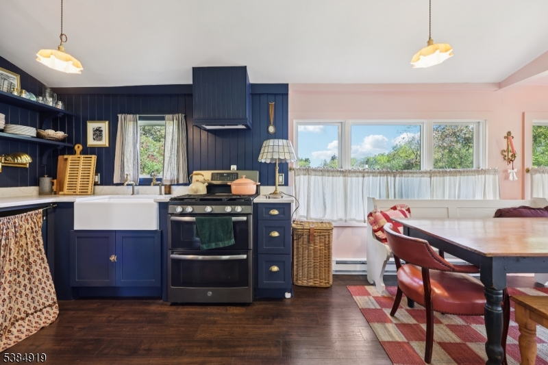 198 Libertyville Road Wantage, NJ 07461 - Photo 10 of 29 a living room with furniture a fireplace and a table