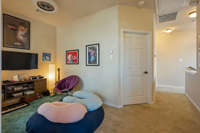 a room with furniture and a flat screen tv