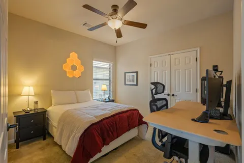 a bedroom with a bed and a table