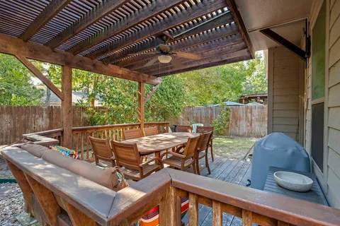 a view of sitting area with furniture and wooden floor