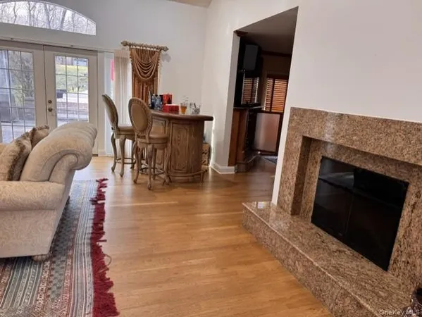 a living room with furniture and a rug