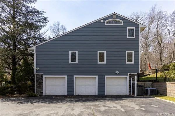 a view of backyard with swimming pool and sitting area