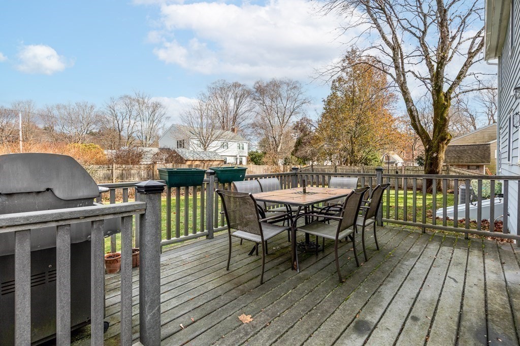 32 Norman Road Hamilton, MA 01982 - Photo 36 of 39 a view of a roof deck with table and chairs and wooden floor