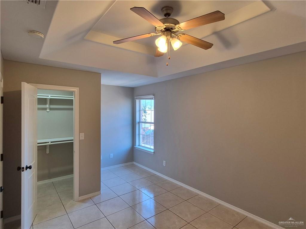 607 Jade Street, Unit 3 Edinburg, TX 78541 - Photo 18 of 19 wooden floor in an empty room with a window