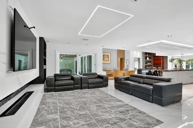 a bedroom with a bed couch and window