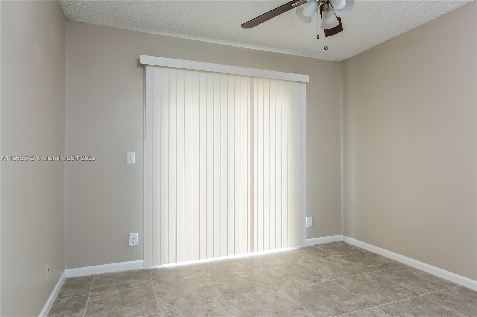 134 Timberline Drive Jupiter, FL 33458 - Photo 11 of 15 an empty room with a window