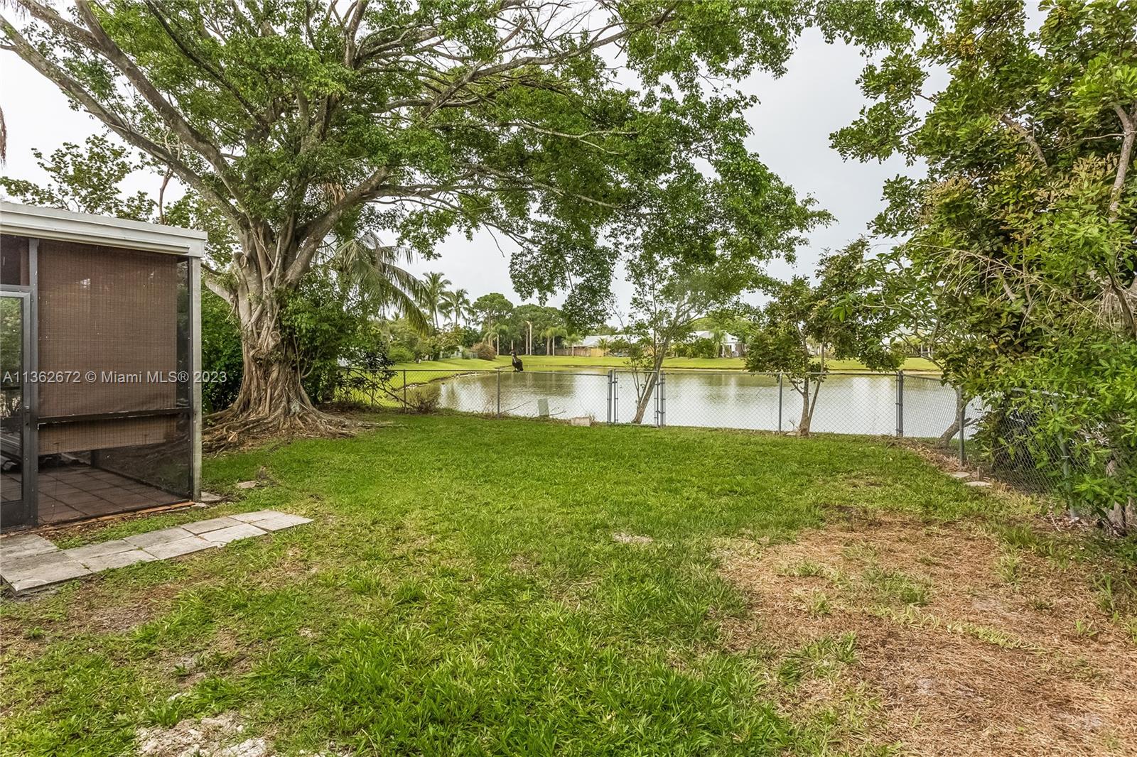 134 Timberline Drive Jupiter, FL 33458 - Photo 15 of 15 a view of outdoor space with deck and trees