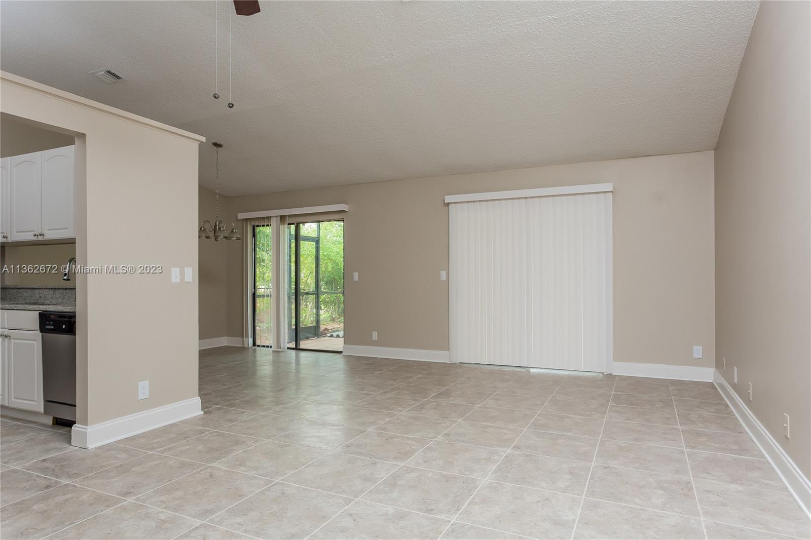 134 Timberline Drive Jupiter, FL 33458 - Photo 3 of 15 a view of an empty room with a window