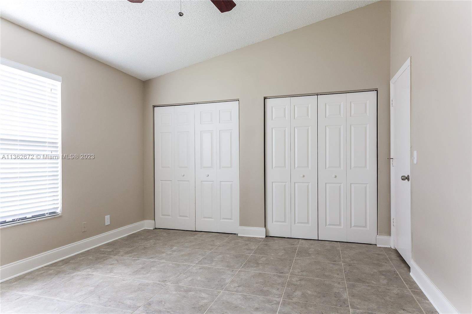 134 Timberline Drive Jupiter, FL 33458 - Photo 7 of 15 a view of an empty room and window