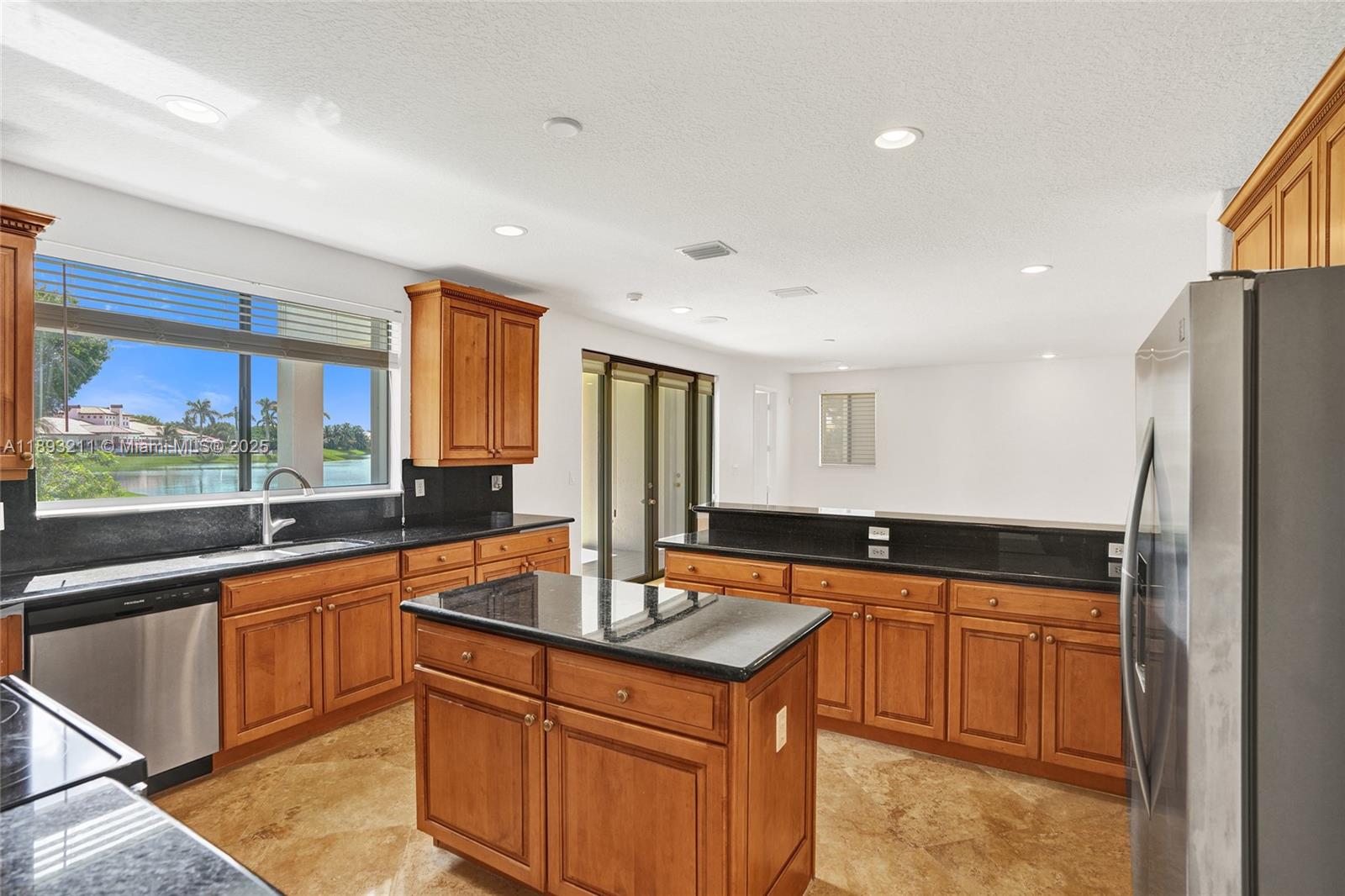 7722 Southwest 188th Terrace Cutler Bay, FL 33157 - Photo 11 of 89 a kitchen with stainless steel appliances granite countertop a sink a stove and a refrigerator
