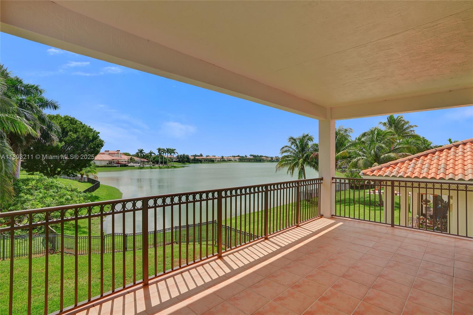 7722 Southwest 188th Terrace Cutler Bay, FL 33157 - Photo 2 of 89 a view of a street with a balcony