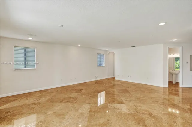 a spacious bathroom with sink shower and bathtub