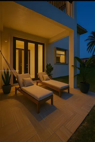 a building outdoor space with patio furniture and potted plants