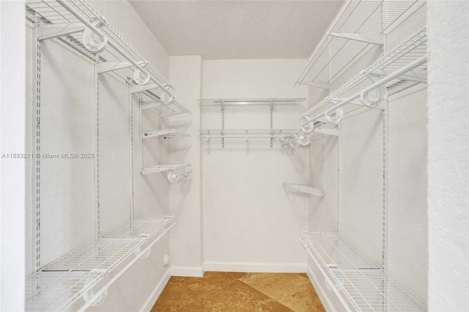 7722 Southwest 188th Terrace Cutler Bay, FL 33157 - Photo 36 of 89 a bathroom with a tub shower and vanity