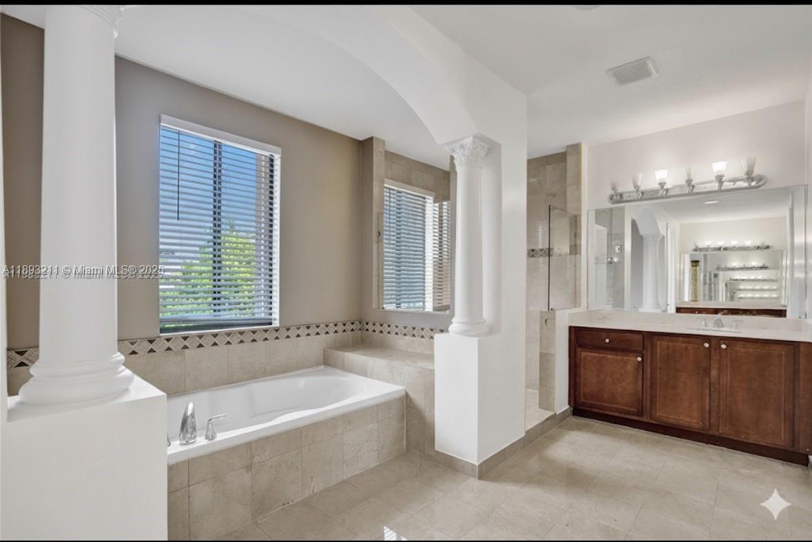 7722 Southwest 188th Terrace Cutler Bay, FL 33157 - Photo 37 of 89 a spacious bathroom with sink shower and bathtub