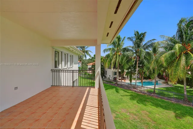 a view of kitchen with granite countertop cabinets and wooden floor