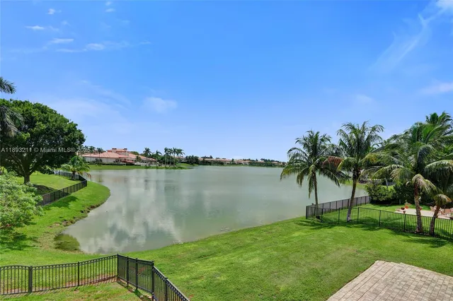 a bathroom with a sink toilet and a mirror